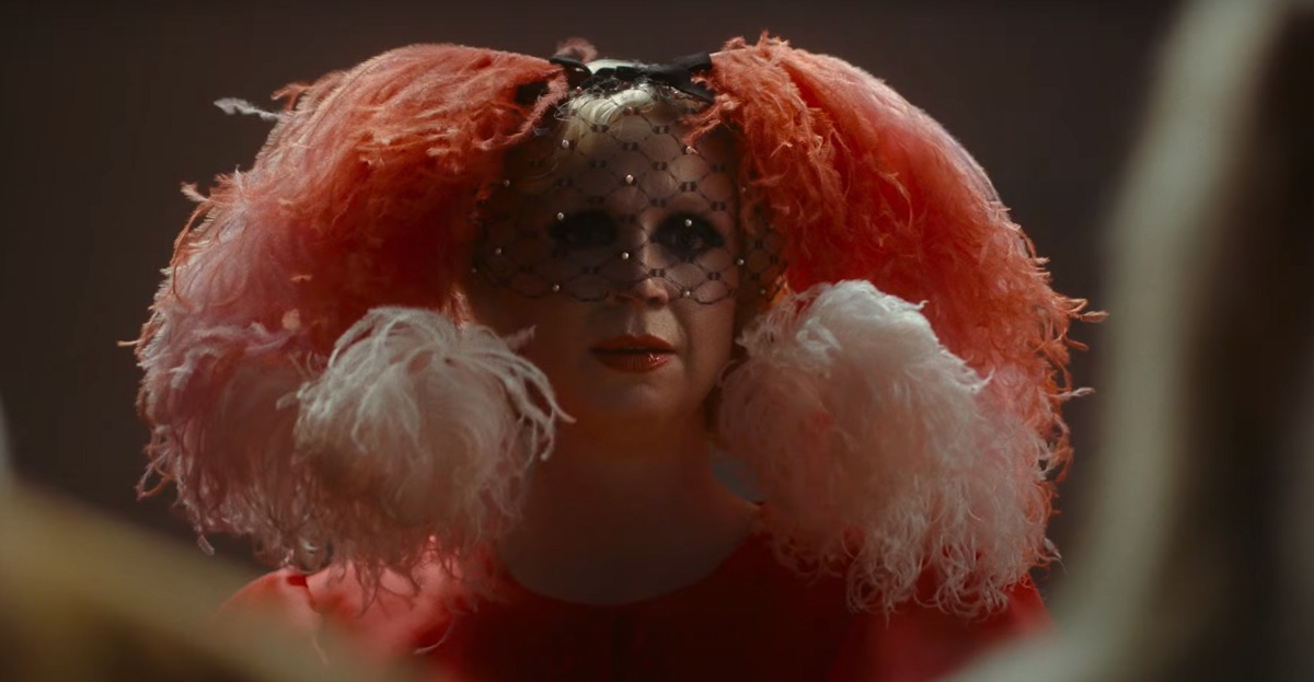 Gwendoline Christie wears a bizarre, frilly headdress in Flux Gourmet.