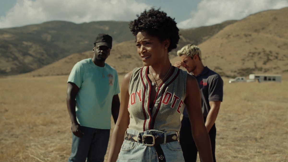 Keke Palmer stands in foreground while Daniel Kaluuya and Brandon Perea are in the background in Nope