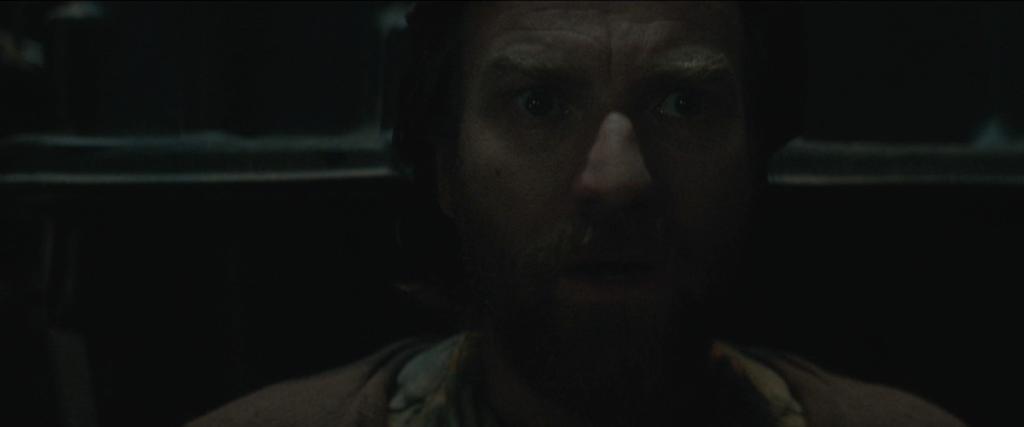 Ewan McGregor as Obi-Wan Kenobi reacts in silent horror as he finds out after ten years that Anakin Skywalker is still alive in Obi-Wan Kenobi (2022).
