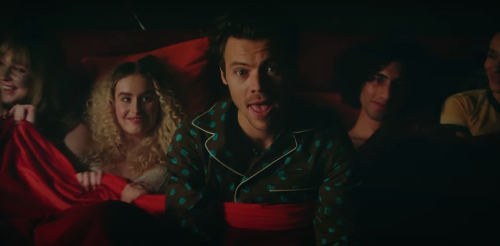 Harry Styles can be seen in bed with multiple people in one scene.