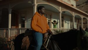 Daniel Kaluuya sits on a horse in Nope