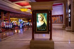 A promotional billboard touting the upcoming concerts by singer Adele is viewed inside Caesars Palace Hotel & Casino on January 9, 2022 in Las Vegas