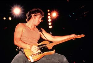 Bruce Springsteen performs during a stop on his "Born in the USA" tour between 1984 and 1985.