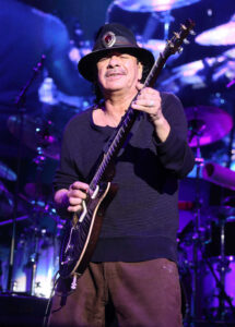 Guitarist Carlos Santana collapsed from dehydration while performing in Michigan : NPR