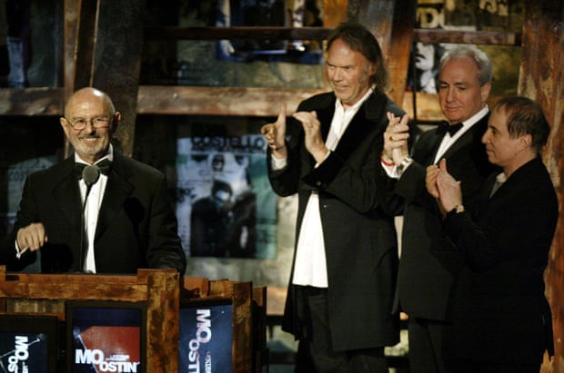 Tribute … Mo Ostin, left, is inducted into the Rock and Roll Hall of Fame, as Neil Young, Lorne Michaels and Paul Simon look on.