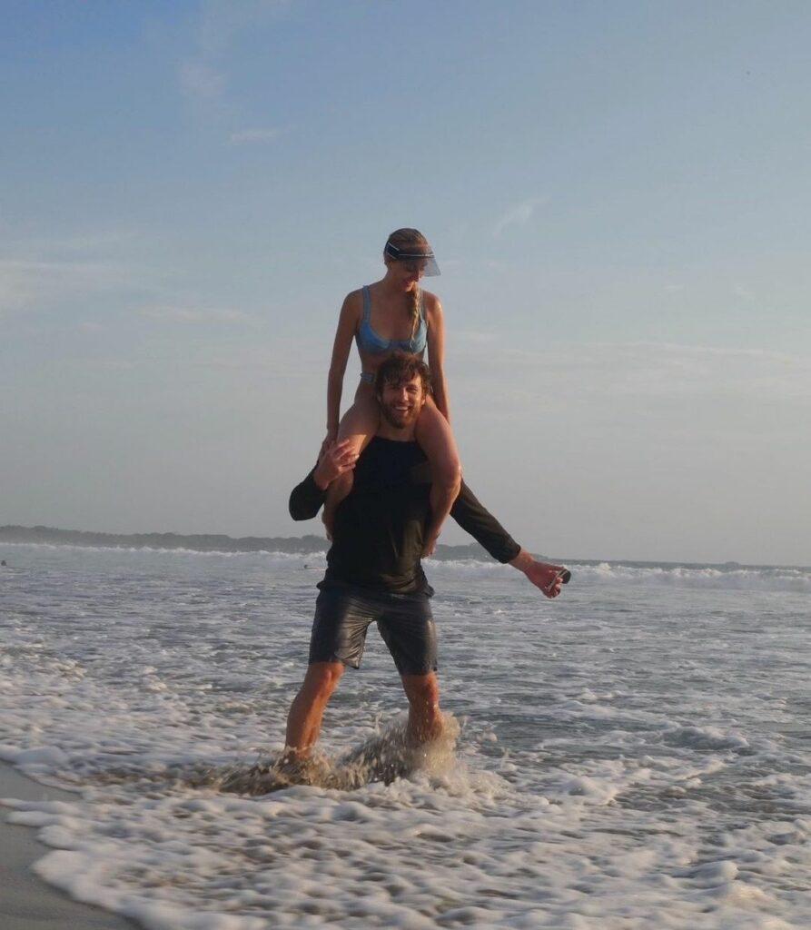 Nastia Liukin carried by her boyfriend on his back.