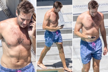 Armie Hammer goes shirtless & reveals bizarre new tattoo in rare public outing