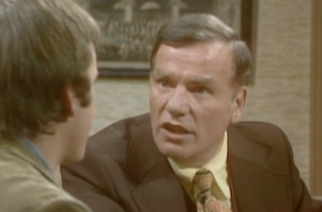 Actor William Pearson appearing in "Three's Company," wearing a suit and tie