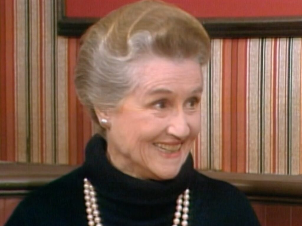 Irene Tedrow appearing in "Three's Company" wearing black top with pearl necklace