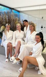 Kardashian fans spotted a bizarre detail in a photo of Kim alongside friends all wearing matching bathrobes