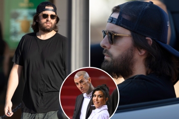 Scott looks solemn on rare outing as ex Kourtney shares PDA with husband Travis