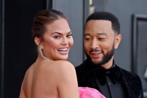 LAS VEGAS, NEVADA - APRIL 03: Chrissy Teigen and John Legend attends the 64th Annual GRAMMY Awards at MGM Grand Garden Arena on April 03, 2022 in Las Vegas, Nevada. (Photo by Axelle/Bauer-Griffin/FilmMagic)