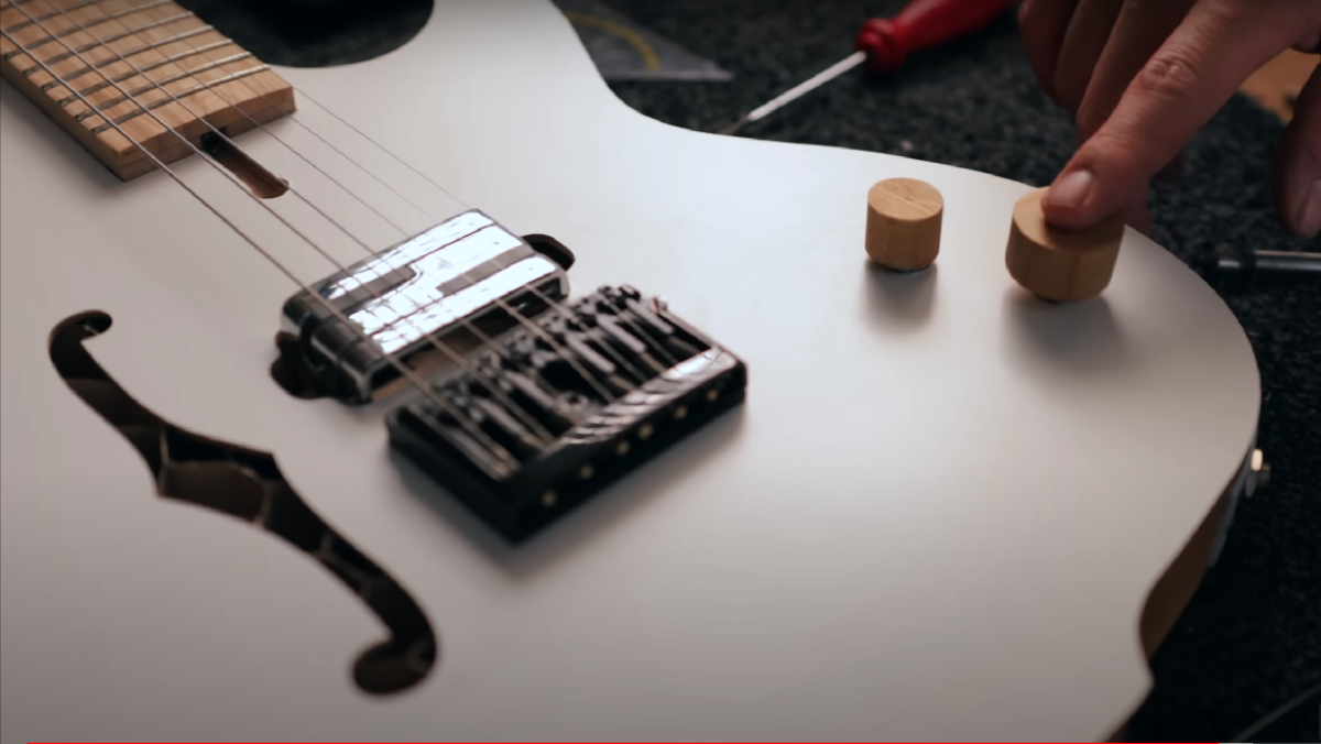 A white guitar made from IKEA pieces