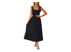A model wears a black sleeveless maxi dress with tie straps and a ruffle on the trim