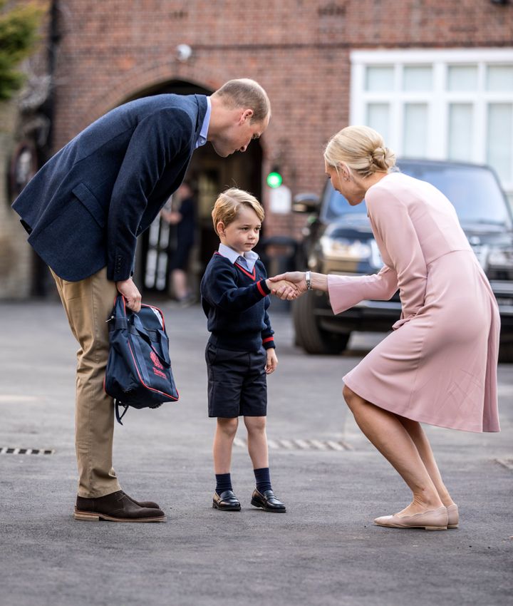 Prince George arrives for his first day of school with his father as they meet Helen Haslem, the head of the lower school, at Thomas's Battersea on Sept. 7, 2017.