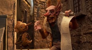 Pinocchio speaks to Count Volpe in a still from Guillermo del Toro’s Pinocchio