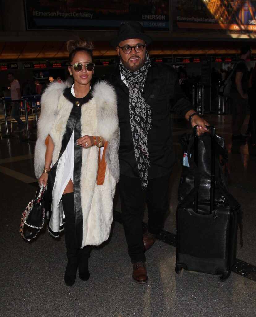 Adrienne Bailon and her husband Israel Houghton depart from Los Angeles International Airport (LAX)