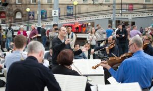 Lars Vogt conducts the Royal Northern Sinfonia at Newcastle station in 2016.
