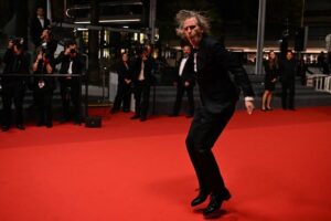 Morgen dancing down the red carpet at the Moonage Daydream premiere at Cannes in May.