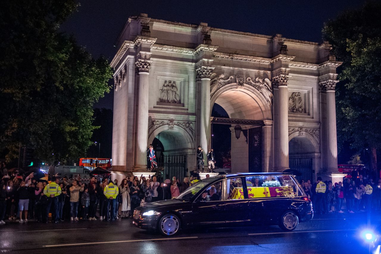 A shot of royal hearse carrying the coffin of Queen Elizabeth II drives past Wellington Arch.
