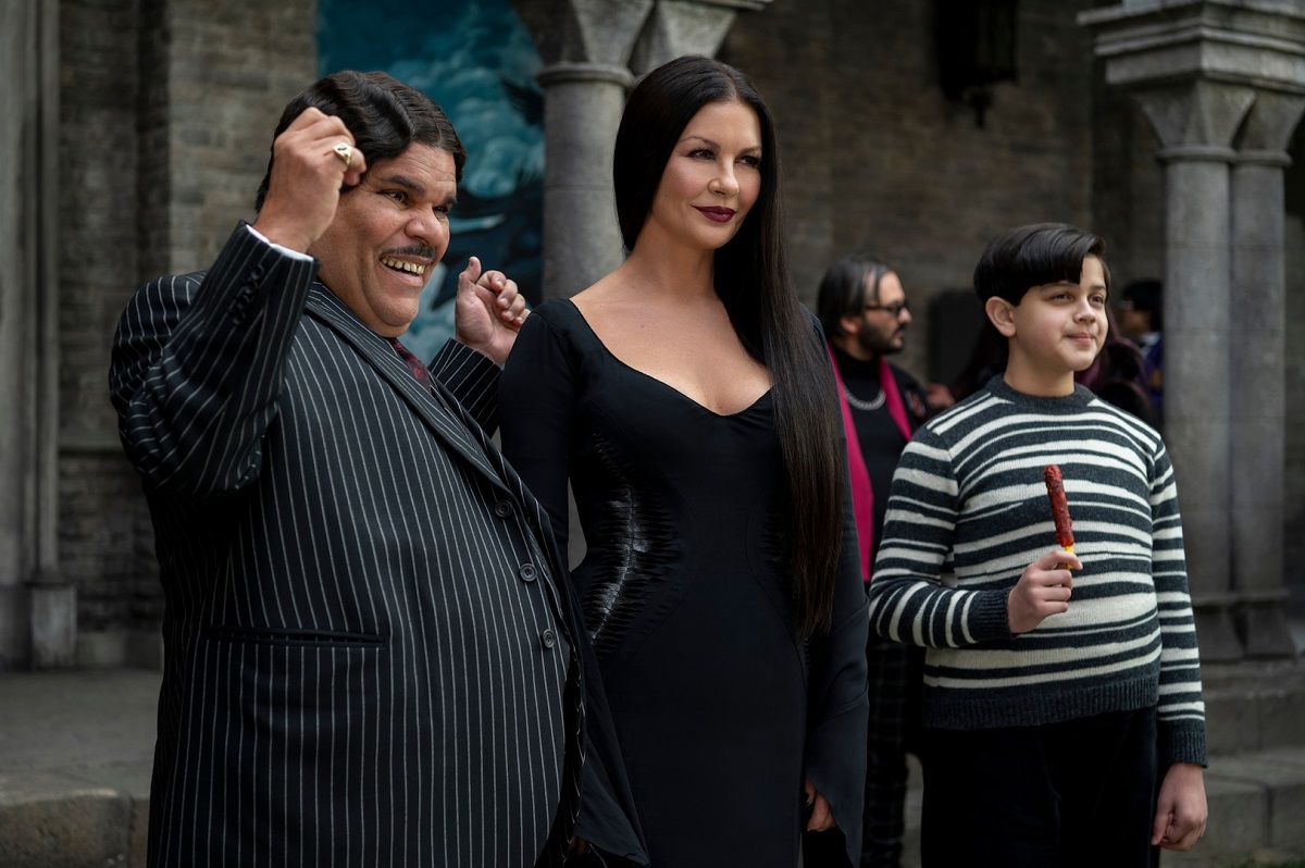 Luis Guzman, Catherine Zeta-Jones, and Issac Ordonez as our new Addams Family on Netflix's Wednesday.