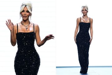 Kim shows off her thin waist in a skintight dress for Dolce & Gabbana show