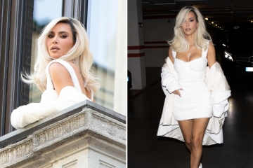 Kim shows off thin thighs & nearly spills out of VERY tight corset dress