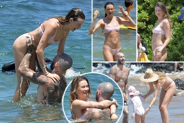 Adam Levine and wife Behati pack on the PDA in Maui as model wears teeny bikini
