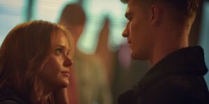 a redhead girl looks deeply into the eyes of a tall blonde boy
