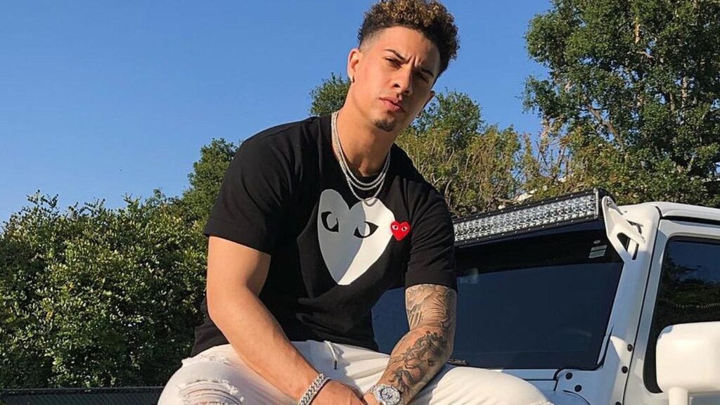 austin mcbroom posing on car