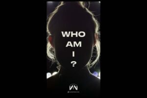 A teaser image of an unidentified woman with text reading “who am I?”