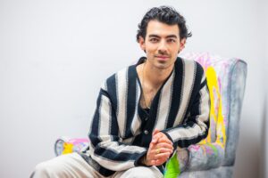 Joe Jonas, singer, songwriter and actor, films a new advertising campaign for EVO Visian® ICL - a new FDA-approved vision correction lens designed for the correction/reduction of myopia (nearsightedness) and astigmatism. Earlier this month, Jonas had EVO lenses implanted by his doctor to upgrade his vision and break free from the hassles of contact lenses and eyeglasses. Visit https://EVOICL.com on Wednesday, August 10, 2022 in Miami, Fla. (Photo by Jesus Aranguren/Invision for STAAR Surgical Company/AP Images)