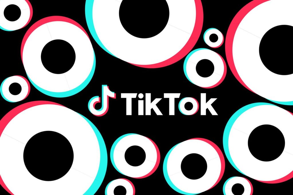 The TikTok logo on a black background with repeating geometric shapes