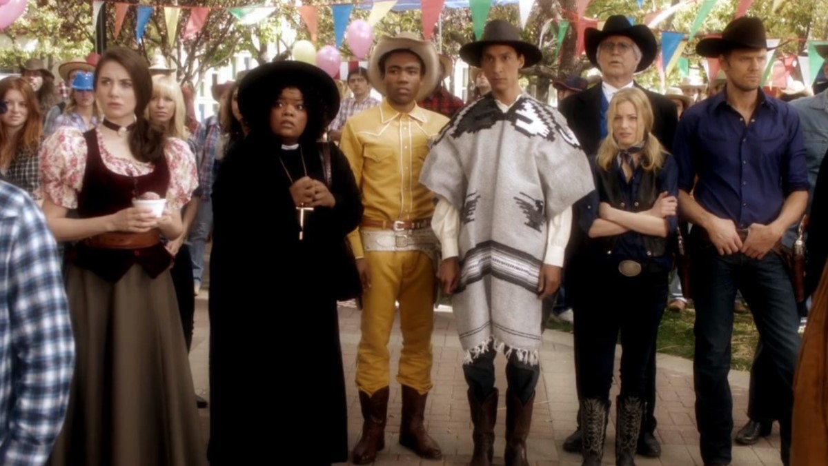 The cast of Community dressed in western attired from a paintball episode