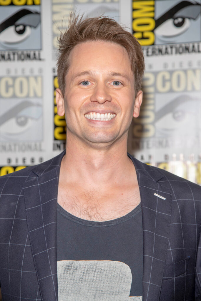 2019 close up of Tyler Ritter smiling in a blue jacket and t-shirt