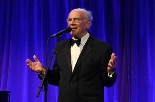 Art Garfunkel speaking onstage during Clive Davis' 90th birthday celebration in April 2022