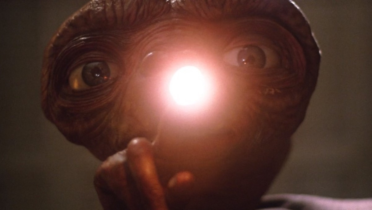 E.T. pointing at the camera with a glowing finger in E.T. the Extraterrestrial