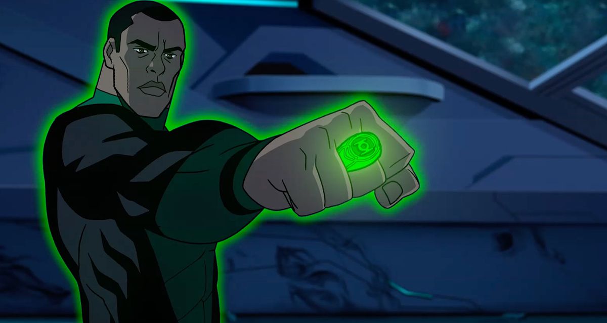 A man in a green and black super-suit holding his fist up with an emerald ring glowing with an aura of green energy that envelops his whole body.