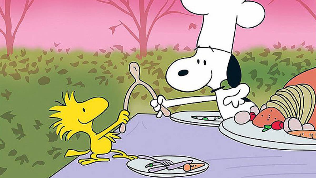 snoopy and woodstock break a wishbone together at thanksgiving dinner charlie brown movie