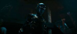A still frame from the Black Panther: Wakanda Forever trailer showing the new female Black Panther standing in her costume.