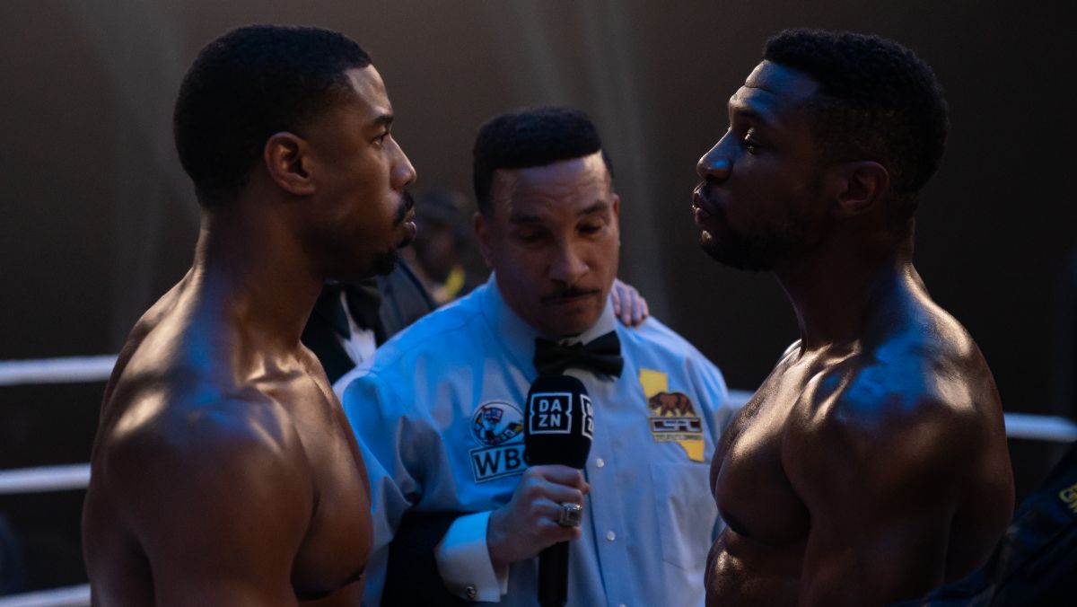 michael b jordan as adonis creed stands across from jonathan majors as damian in the boxing ring in creed iii trailer 