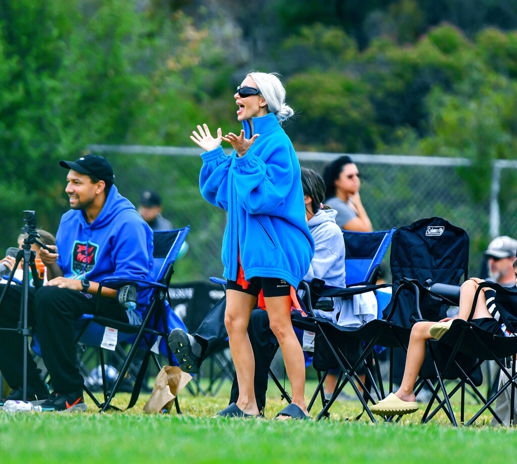 Kim Kardashian looked unrecognisable in a baggy fleece at her six-year-old son Saint's junior football match in Calabasas