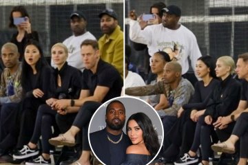 Kim & Kanye sit apart at daughter's game after he threatened ex during interview
