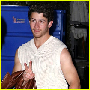 Nick Jonas Flashes His Arms & Peace Sign While Out In West Hollywood