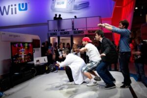 People dance with the Wii Fit U game “Just Dance 4” at the Electronic Entertainment Expo (E3), in Los Angeles, California, 6 June 2012.