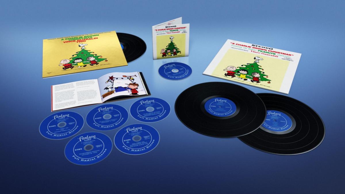 An image from the release of Vince Guaraldi's Christmas Album shows multiple discs, LPs, and their covers for the classic album