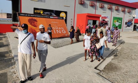 Cinemagoers leaving the Canal Olympia in Cotono after a screening of The Woman King.