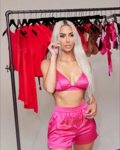 Kim Kardashian showed off her fit figure in a hot pink bra and extra small shorts