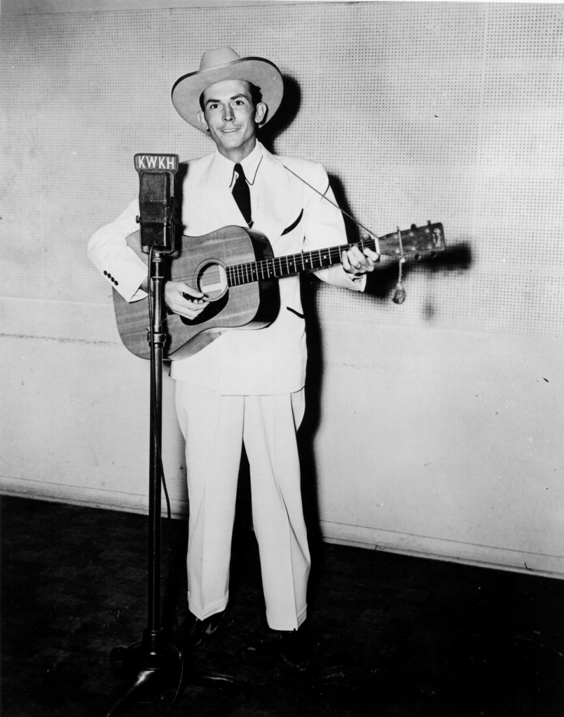 Hank Williams sings during a 1947 Louisiana radio show performance. 