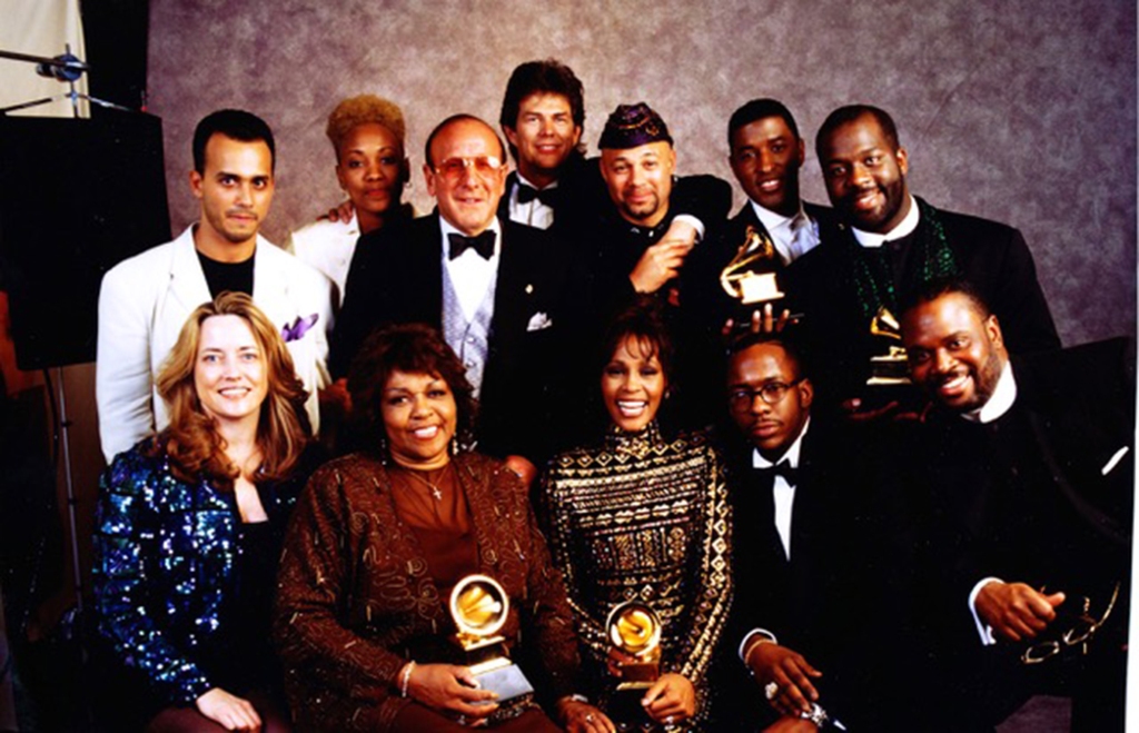 Whitney Houston and team backstage celebrating their 1994 Grammy wins.